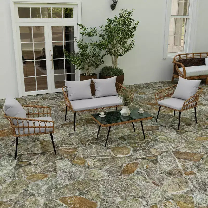 Ensemble de patio bohème Merrick Lane de quatre pièces tressé en corde de rotin naturel pour l'intérieur/l'extérieur avec deux chaises, une causeuse et une table avec coussins